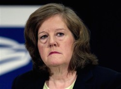 FILE - In this Sept. 15, 2011 file photo, US Postal Service Chief Operating Officer Megan Brennan is seen in Washington. Postmaster General Patrick Donahoe says he'll retire Feb. 1 after leading the struggling agency for four years. He made the announcement Friday at a meeting of the Board of Postal Governors. The board named Postal Service veteran Megan Brennan as the new postmaster general. (AP Photo/Evan Vucci, File)